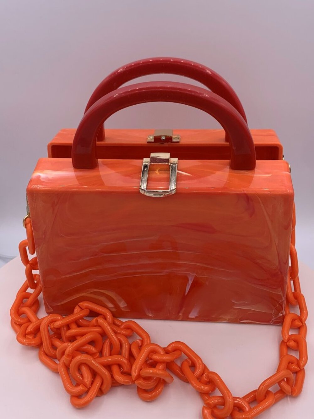 NWOT, hard shell acrylic handbag/purse/cross body.  Holds phone, lots of colour